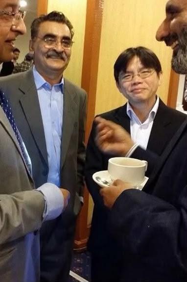 Muhammad Shahzad in conversation with visiting Chinese surveyors at a development seminar held at the PC Hotel in Lahore